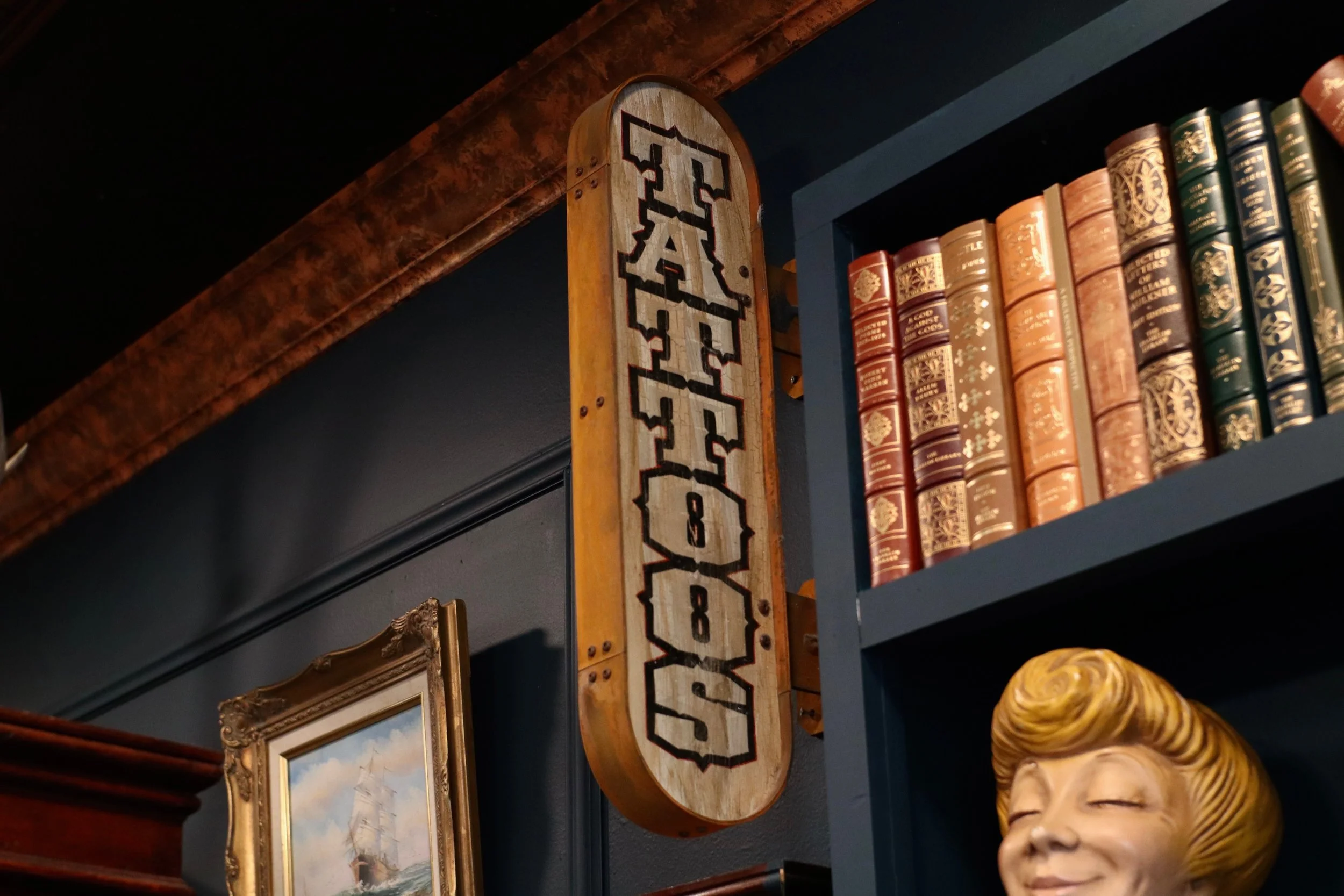 Curated collection of vintage decor and artwork inside Handsome Devil Tattoo Company in Saddle Brook, NJ.