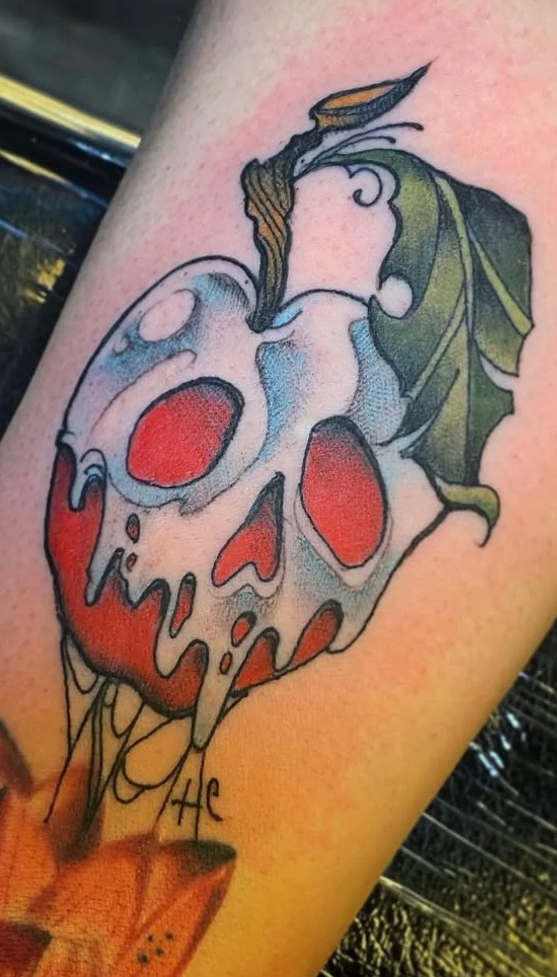 Colorful Poison Apple Tattoo by Russell Kelley at Handsome Devil Tattoo Company in Saddle Brook, NJ.