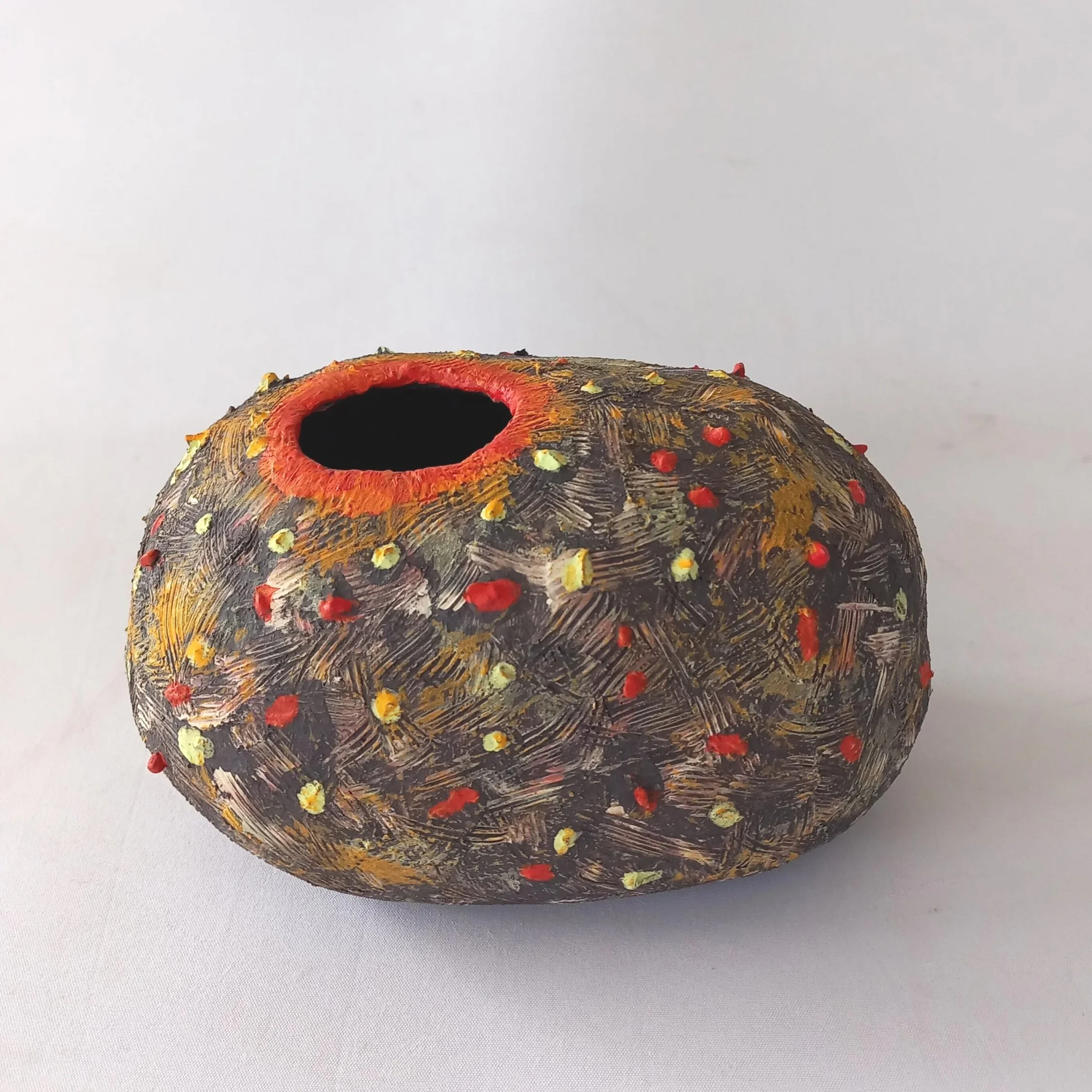 NINETEEN EIGHTY-THREE, 2026, black stoneware, tinted slips, coloured under glazes, 21 x 12 x 14 cm