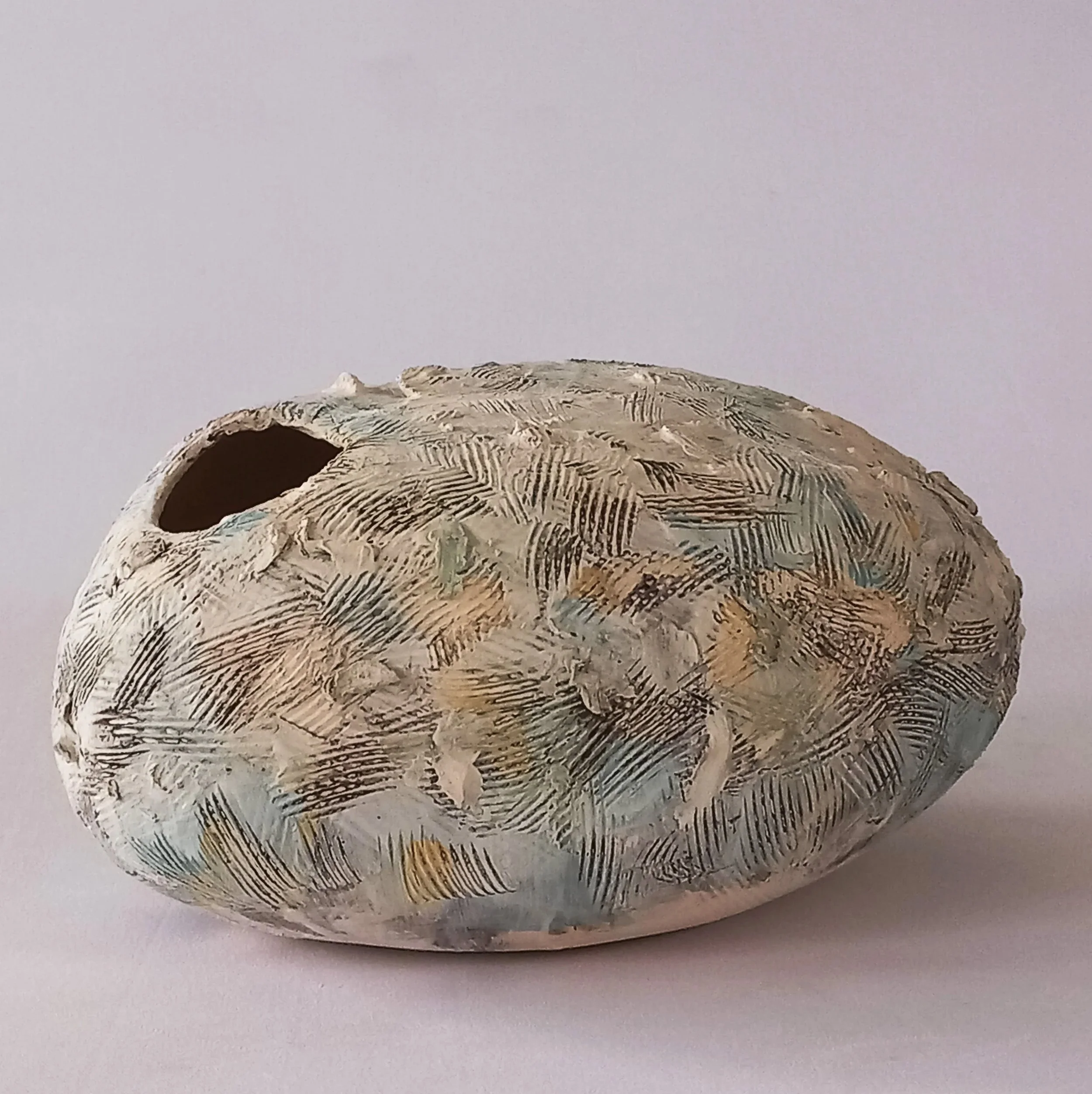 LARGE SLIPPER, 2025, white stoneware, tinted slips, coloured under glazes, 23 x 11 x 16 cm