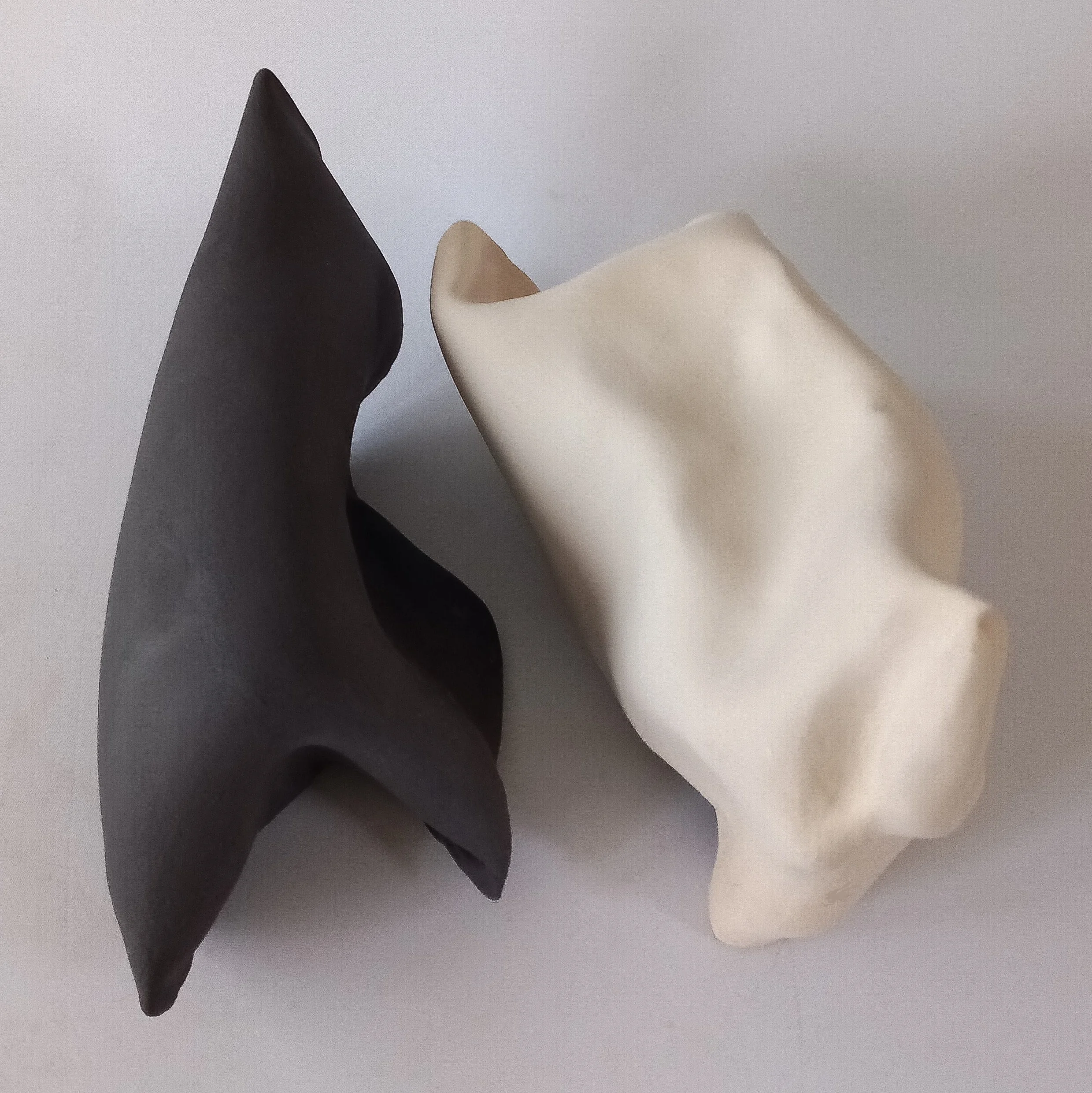 FUN TOGETHER, 2026, black and white stoneware, 33 x 16 x 18 cm and 30 x 21 x 14 cm