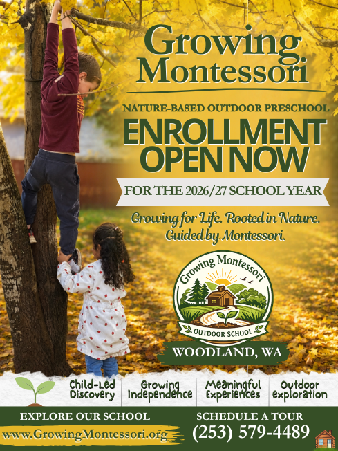 Young boy helping a young girl climb a tree in a park during autumn, with yellow leaves in the background, to promote Growing Montessori outdoor preschool enrollment.