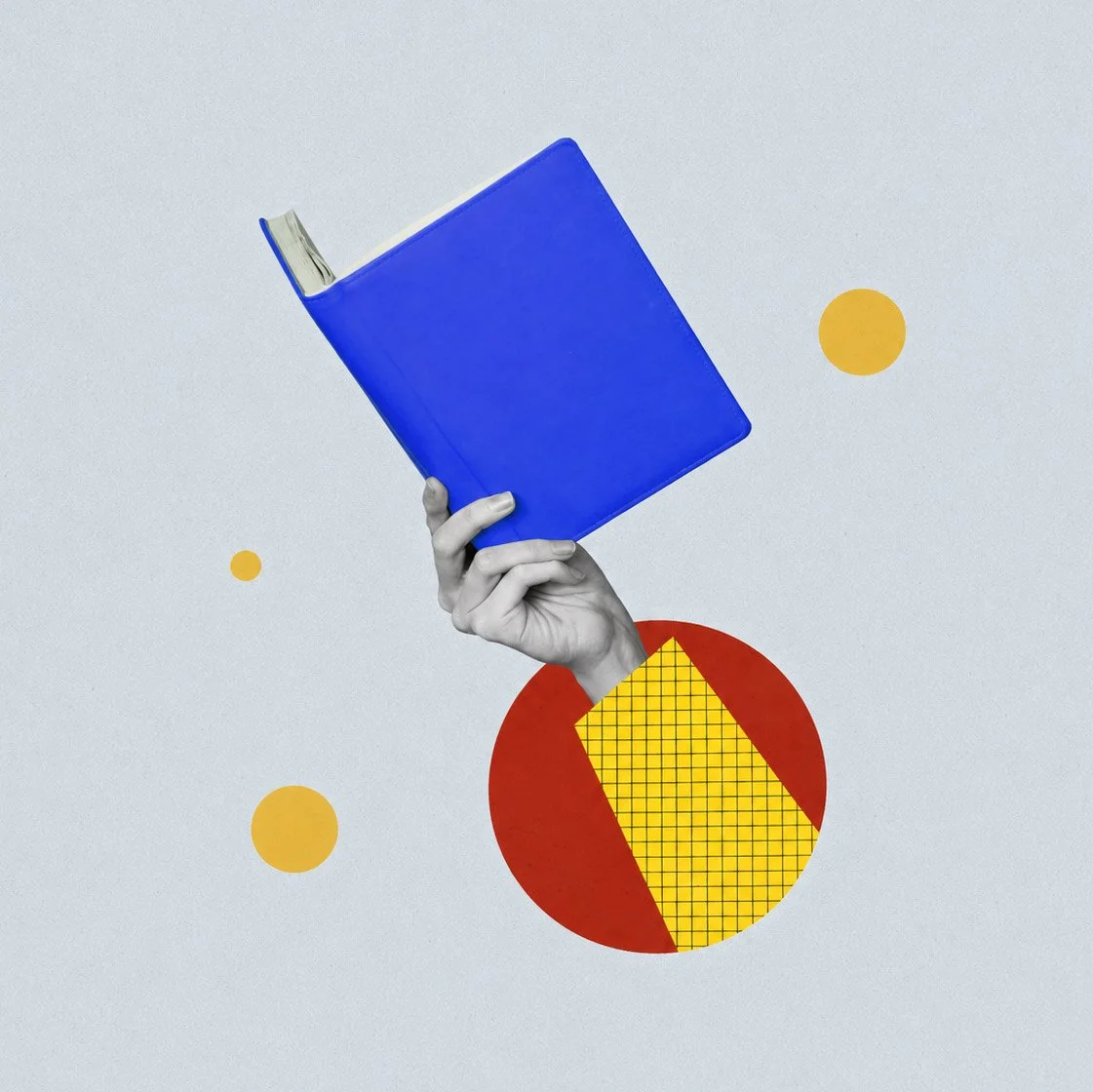 A hand holding a blue book against a background with yellow and red geometric shapes on a light gray wall.