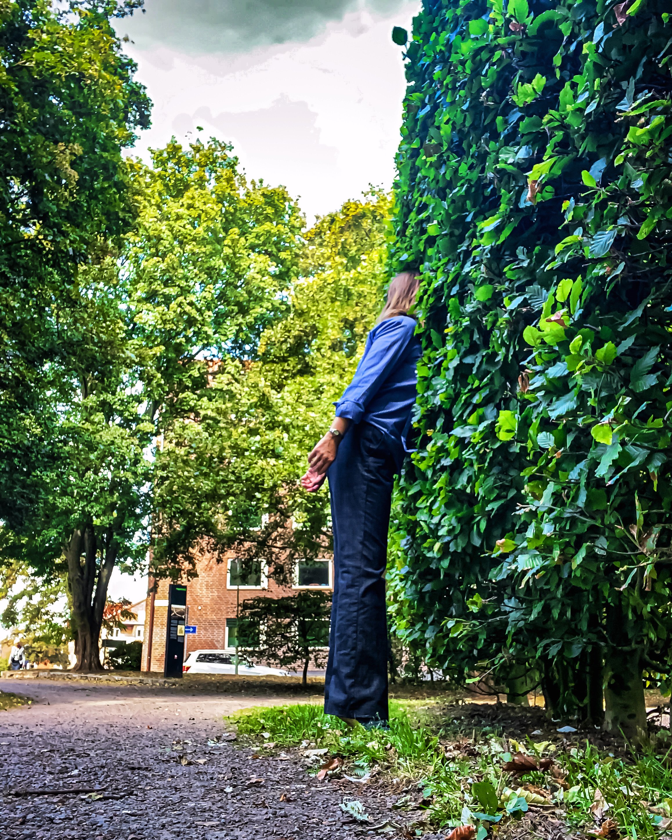 Laura Geiger Deep Puppetry with her head in a tree