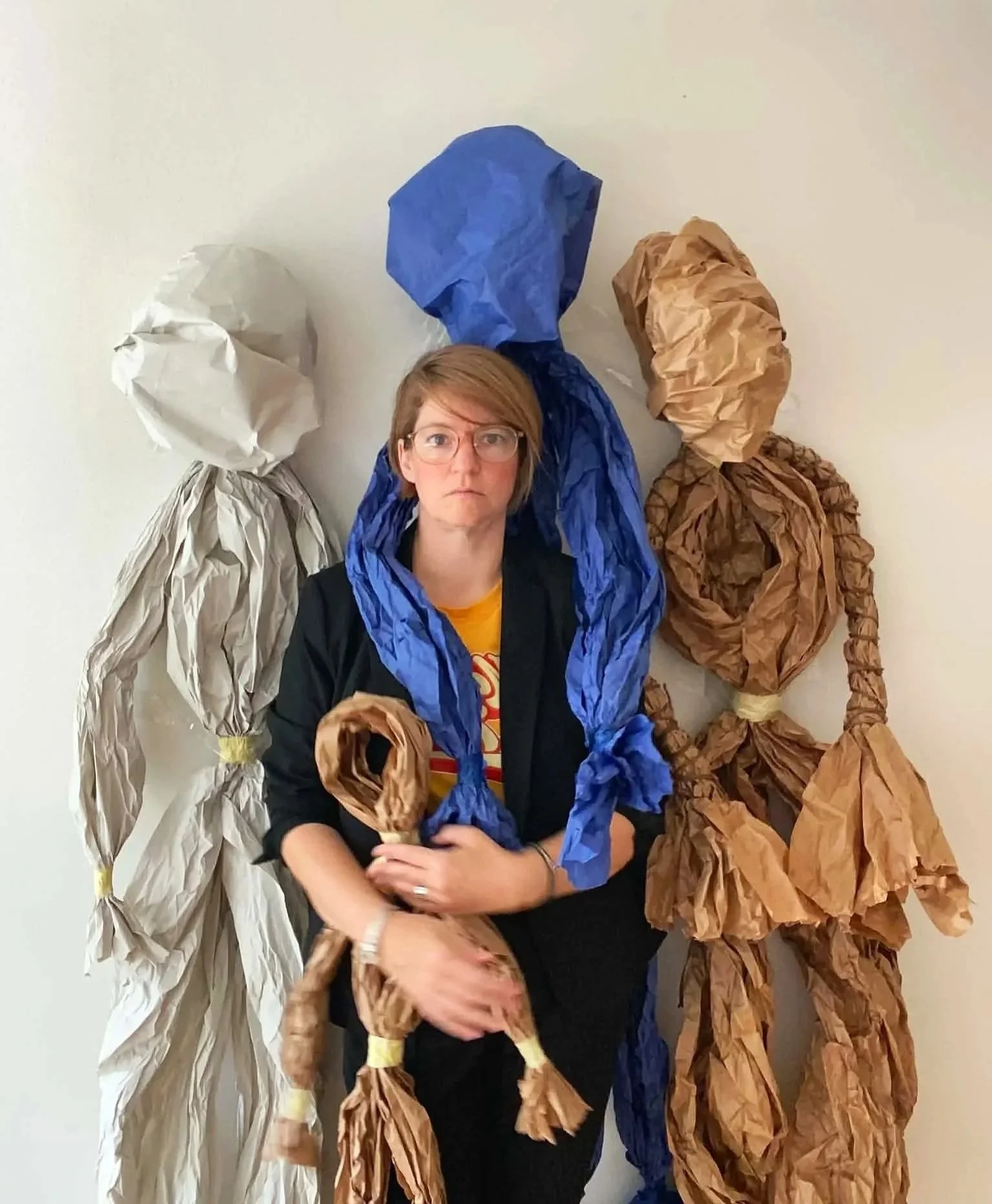 Laura Geiger with life-size paper puppets