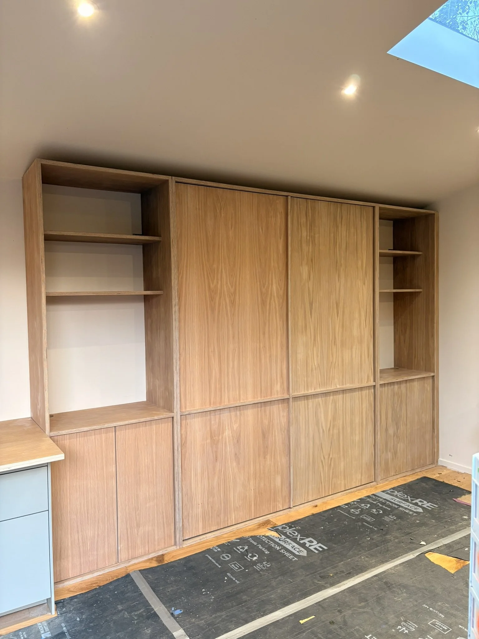 Bespoke oak veneer ply folding bed & storage units.