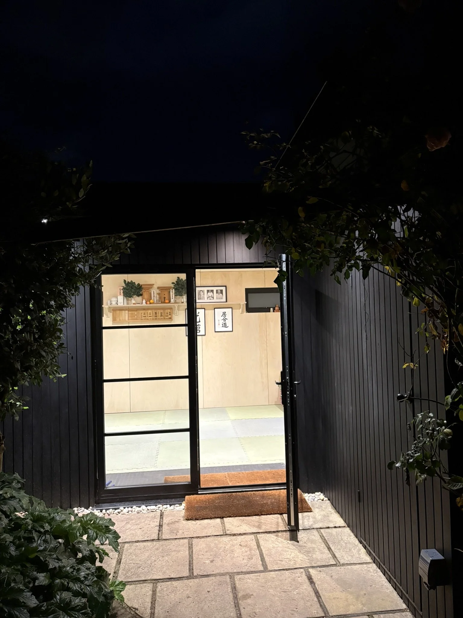 Dojo entrance with burnt oak cladding and secret door.