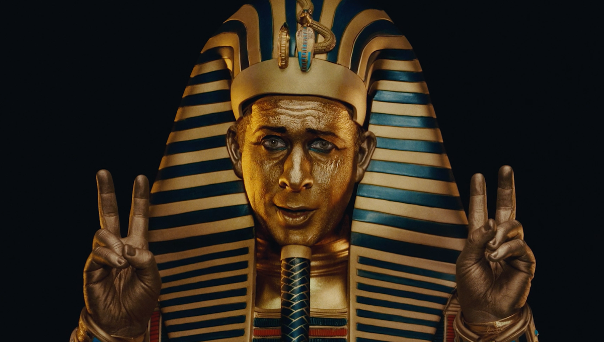 Vaulted ad featuring a gold King Tut making air quotes with hands