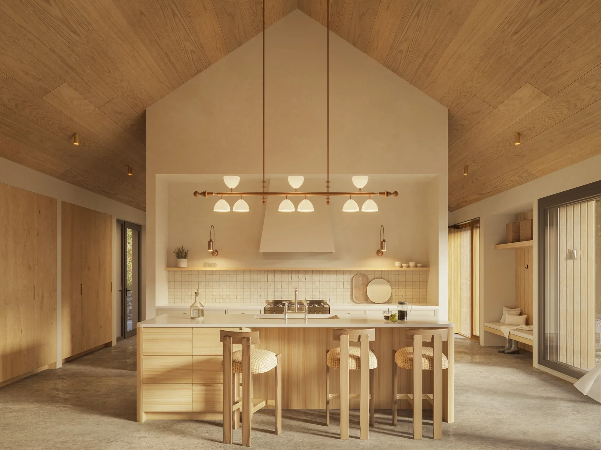 Modern kitchen with light wood cabinets, white island, hanging pendant lights, and sliding glass doors.