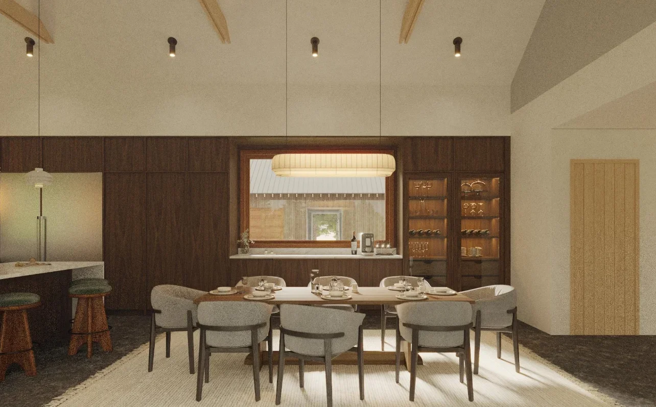 A dining room with a wooden table set for eight, surrounded by gray upholstered chairs, with a large window and a wooden cabinet in the background.