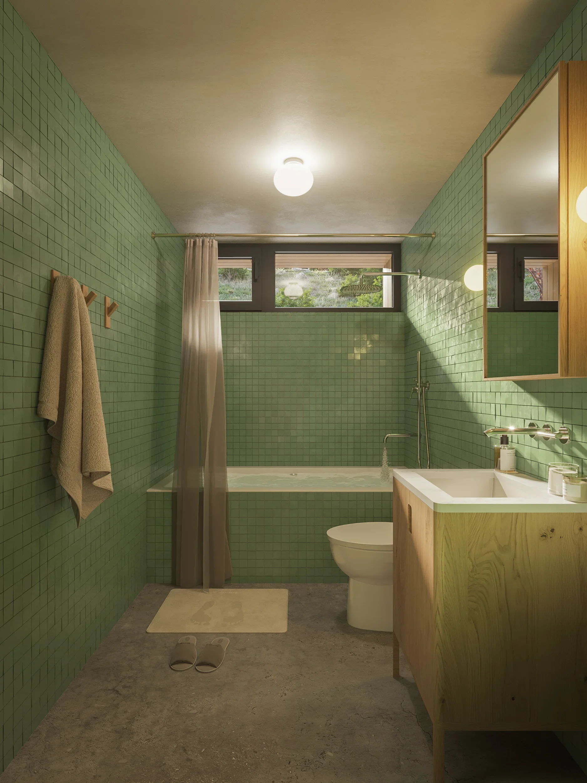 Modern bathroom with green tiled walls, a window with a white curtain, a bathtub, a wooden vanity with a sink, a mirror, and beige slippers on a gray floor.