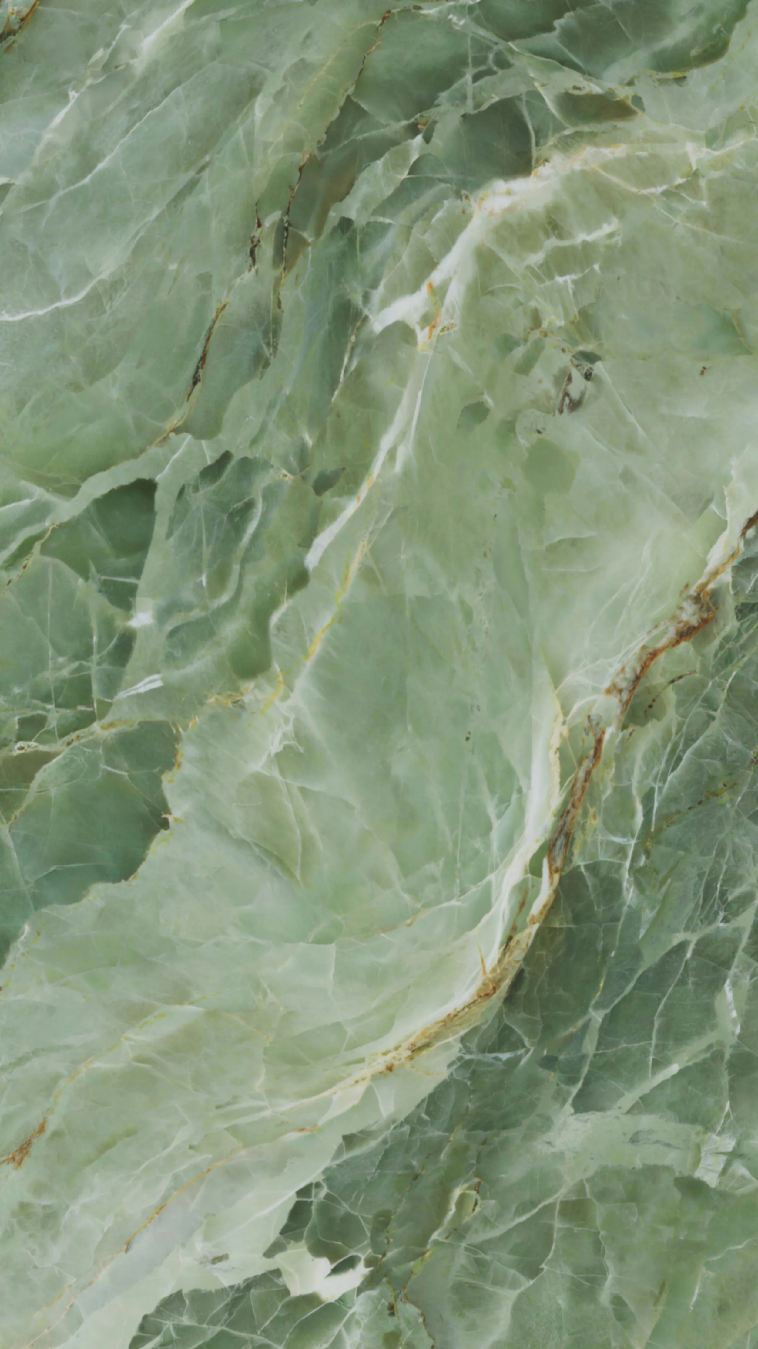 Close-up of green marble or stone surface with white and brown veins.