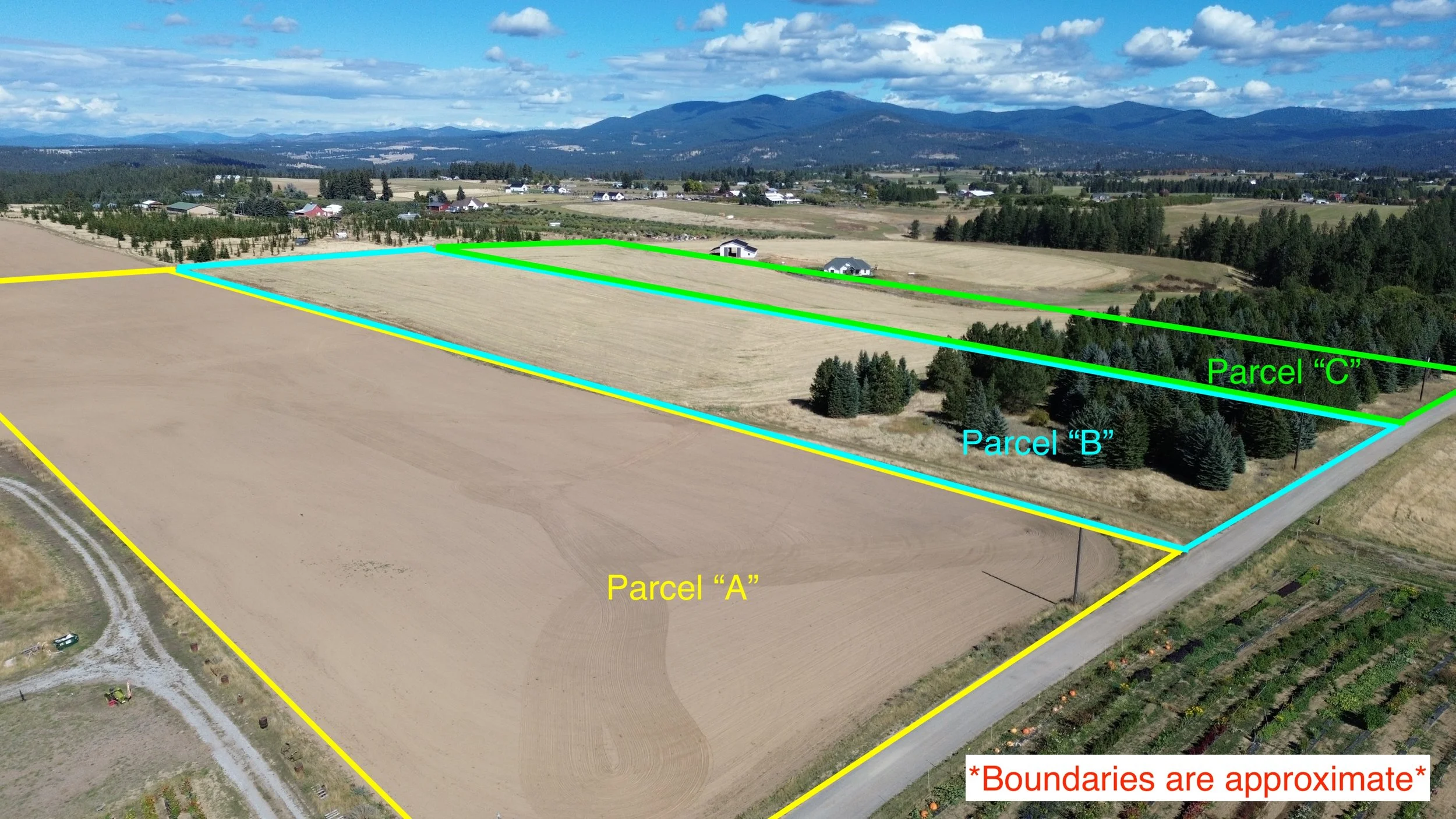 Aerial view of a rural landscape with three outlined parcels of land labeled A, B, and C. Parcel A is marked in yellow, Parcel B in light blue, and Parcel C in green. The parcels are on a farm with fields, trees, and some buildings in the background, with mountains and a partly cloudy sky in the distance.