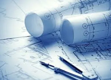 Wicked Maple Design - Blueprint drawings and rolled-up architectural plans on a desk with pens.