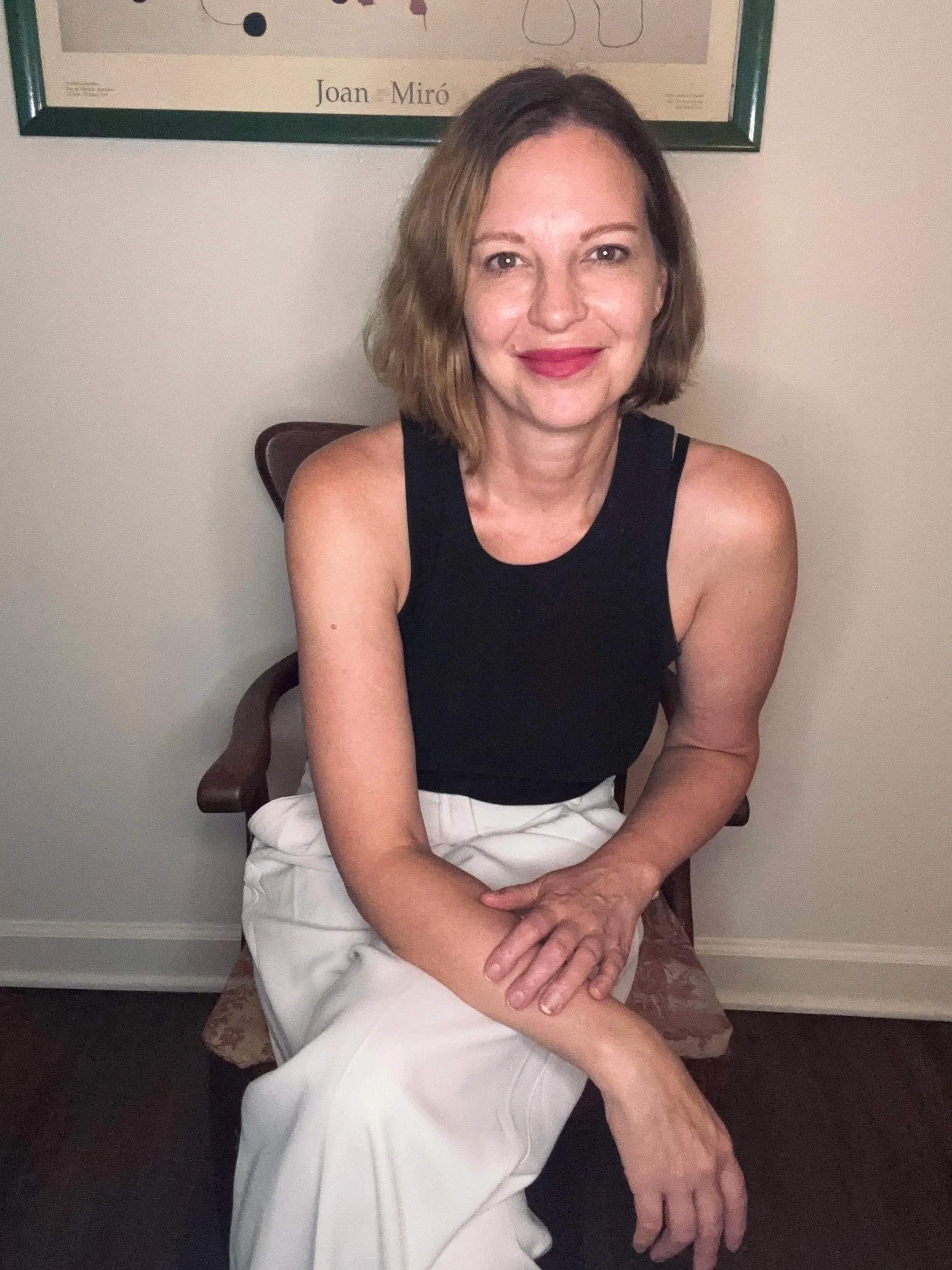 Megan Ethridge, LMFT, smiling while seated, describing her trauma-informed approach to therapy