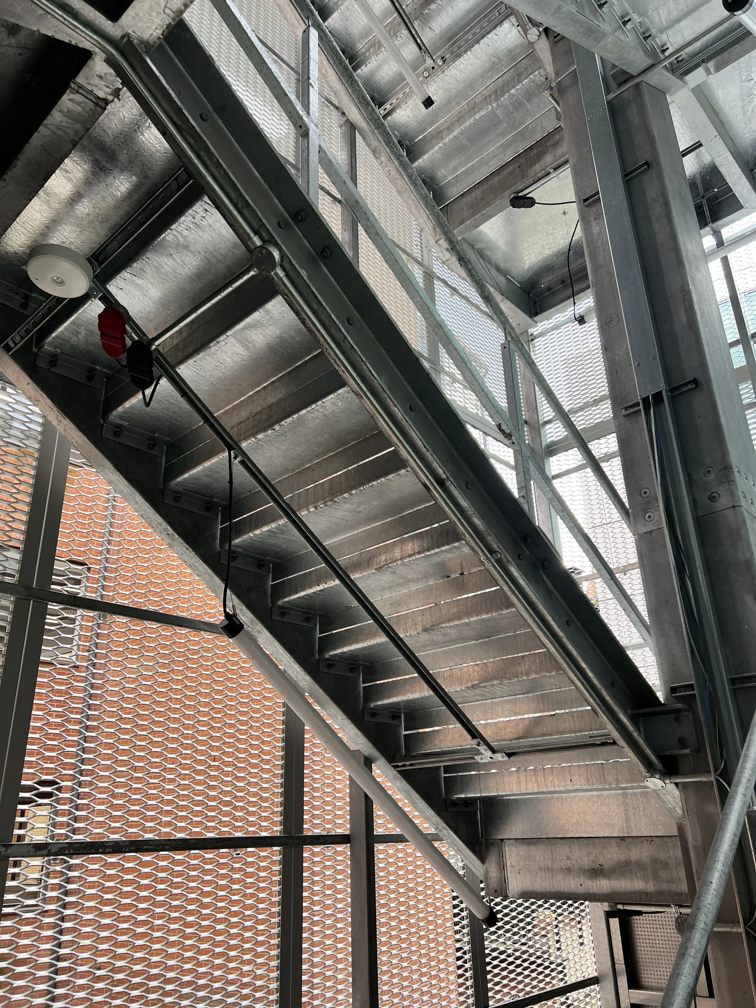 Underside of galvanised steel stair flights and landings within the Reading fire escape.