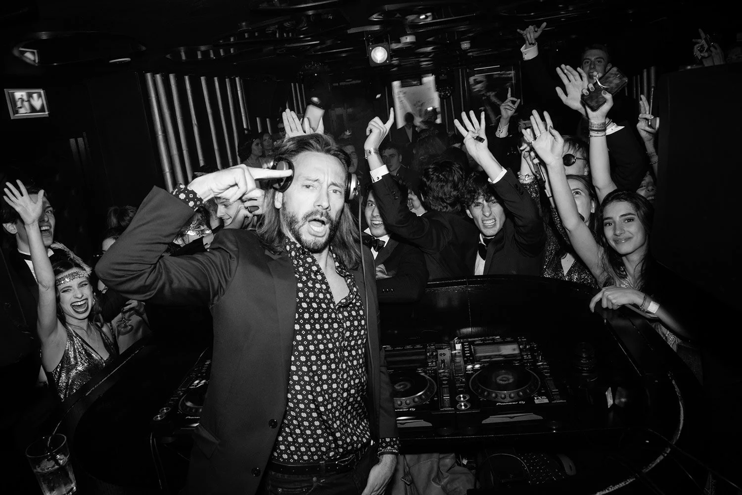 Bob Sinclar performing as guests dance at a private party.