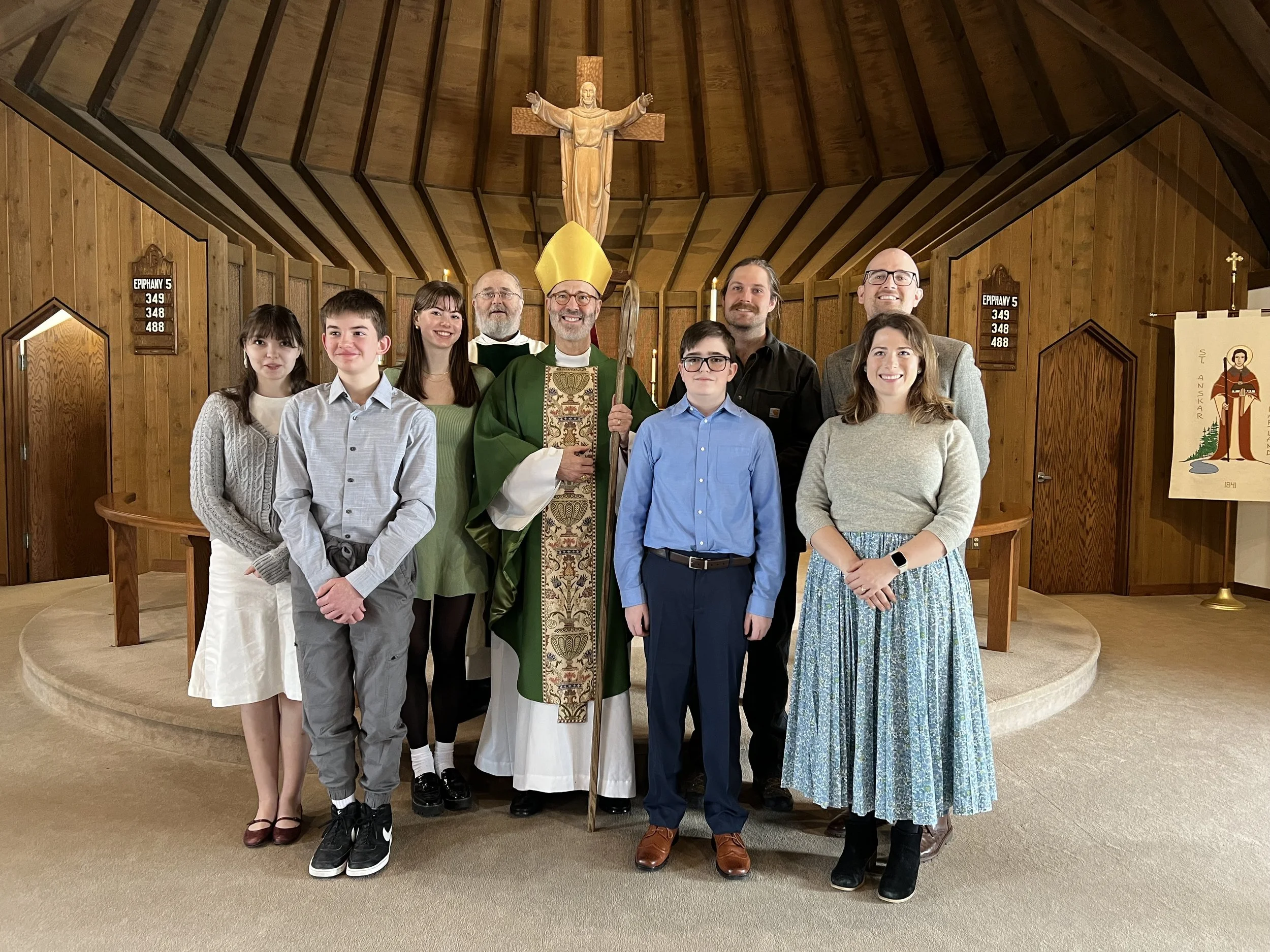 Confirmands gather with the bishop following their Confirmation at St. Anskar's.