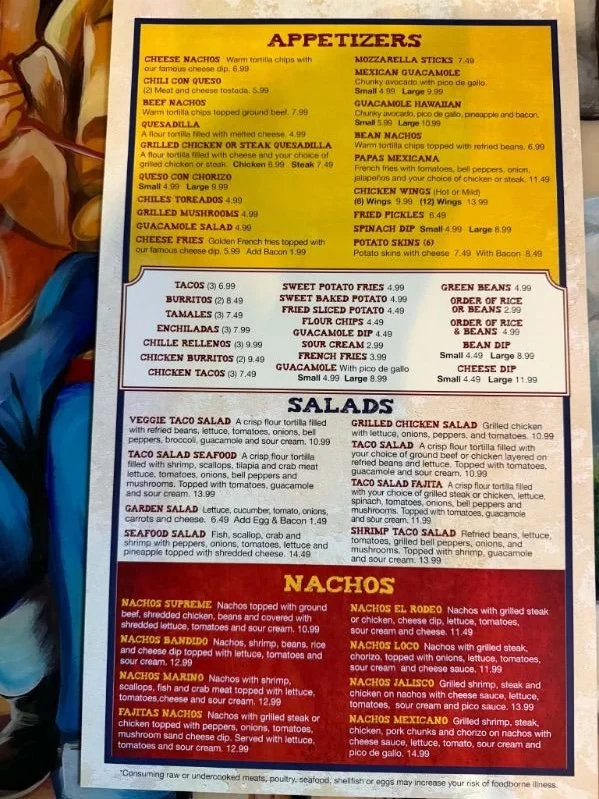 Menu of Mexican restaurant showing appetizers, salads, tacos, nachos, and other dishes with prices.