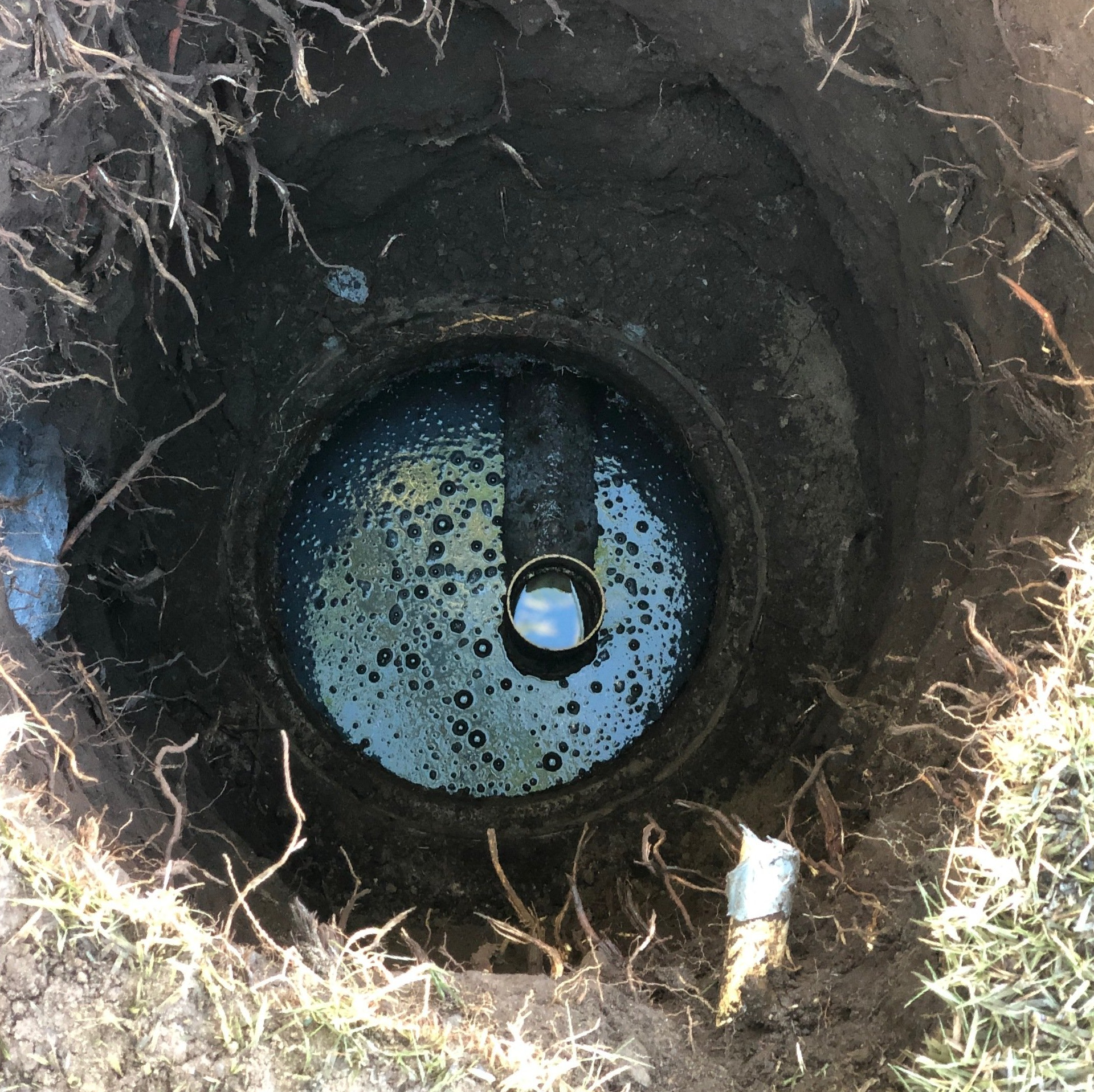 View into an exposed cesspool.