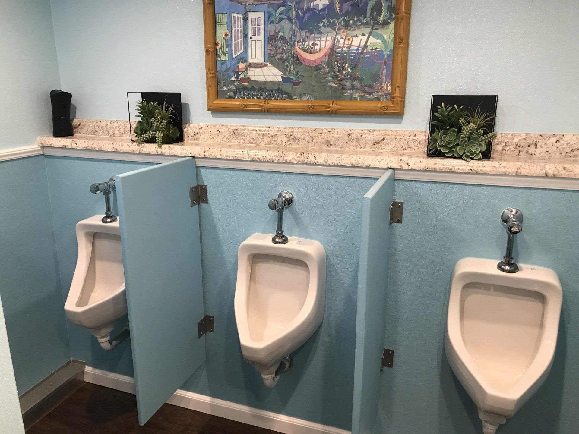 Urinal stations in an event trailer men’s suite