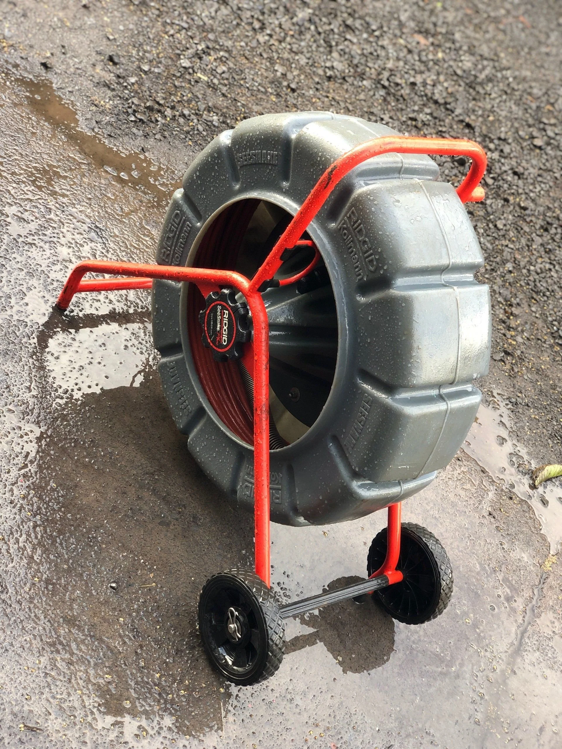 Plumbing inspection camera reel and cable equipment.