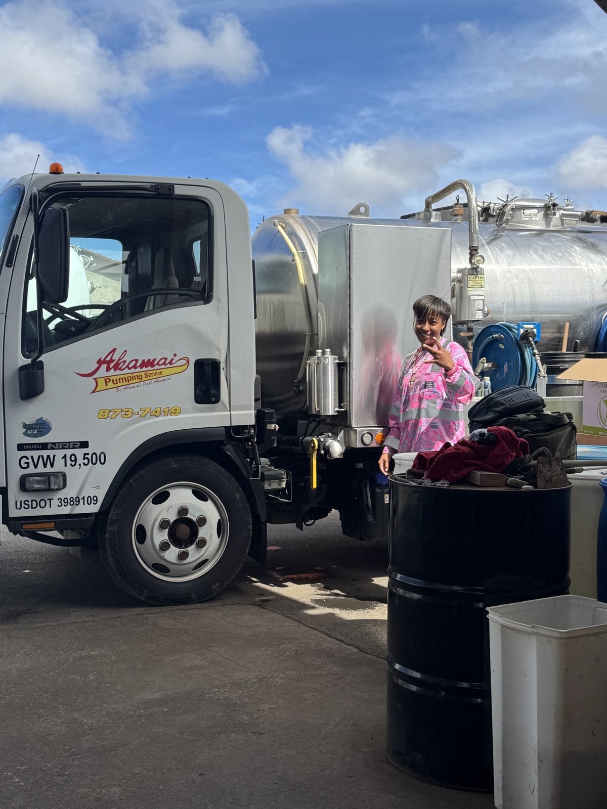 Akamai team member beside a truck and equipment.