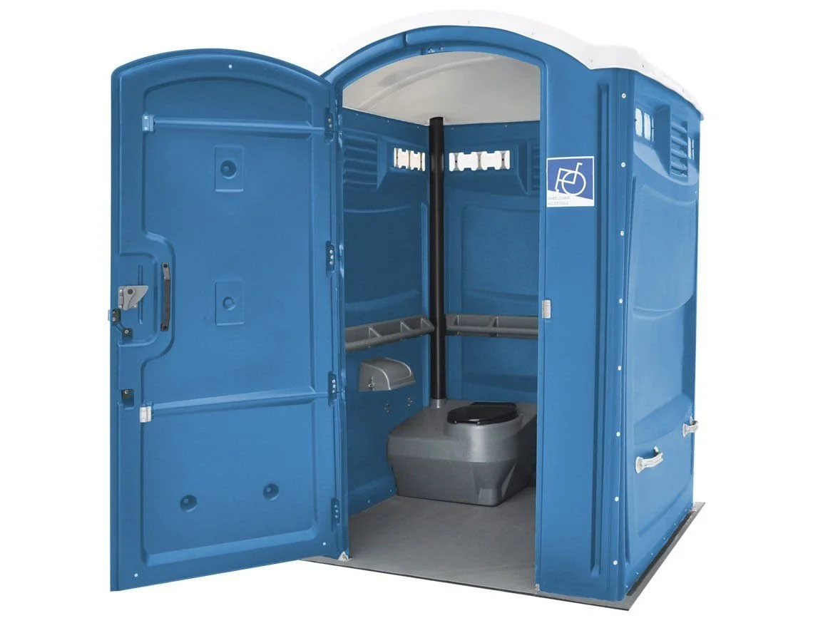 Interior of an accessible portable toilet with wide doorway.