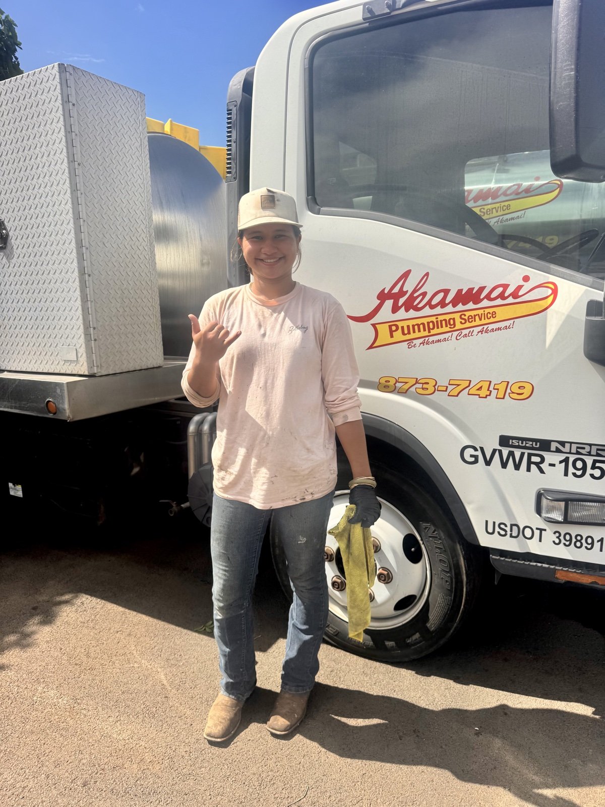 Akamai team member beside a service truck.