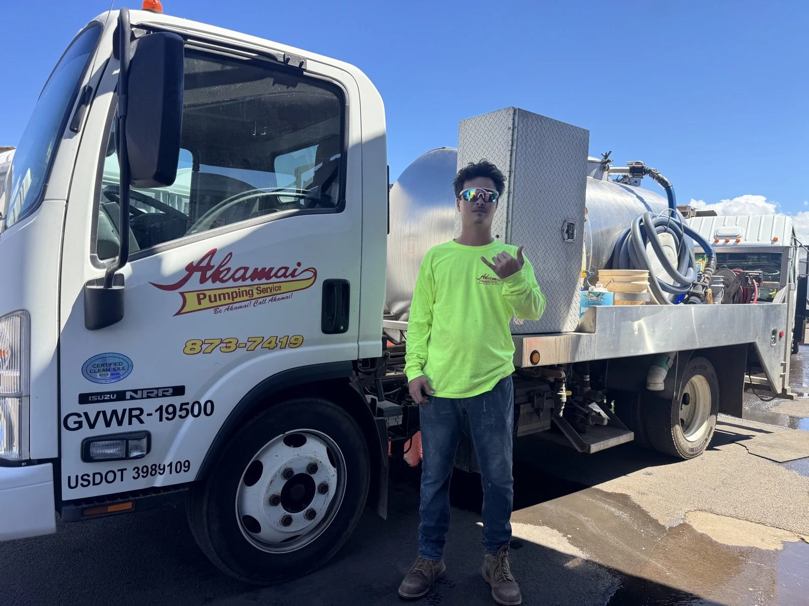 Akamai crew member beside a service truck.