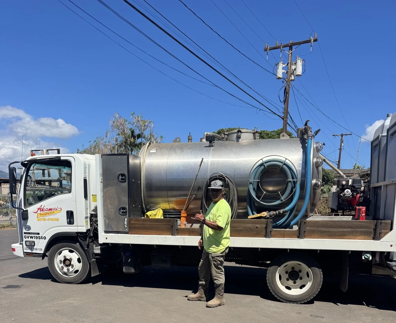 Akamai crew member beside a pumping truck.