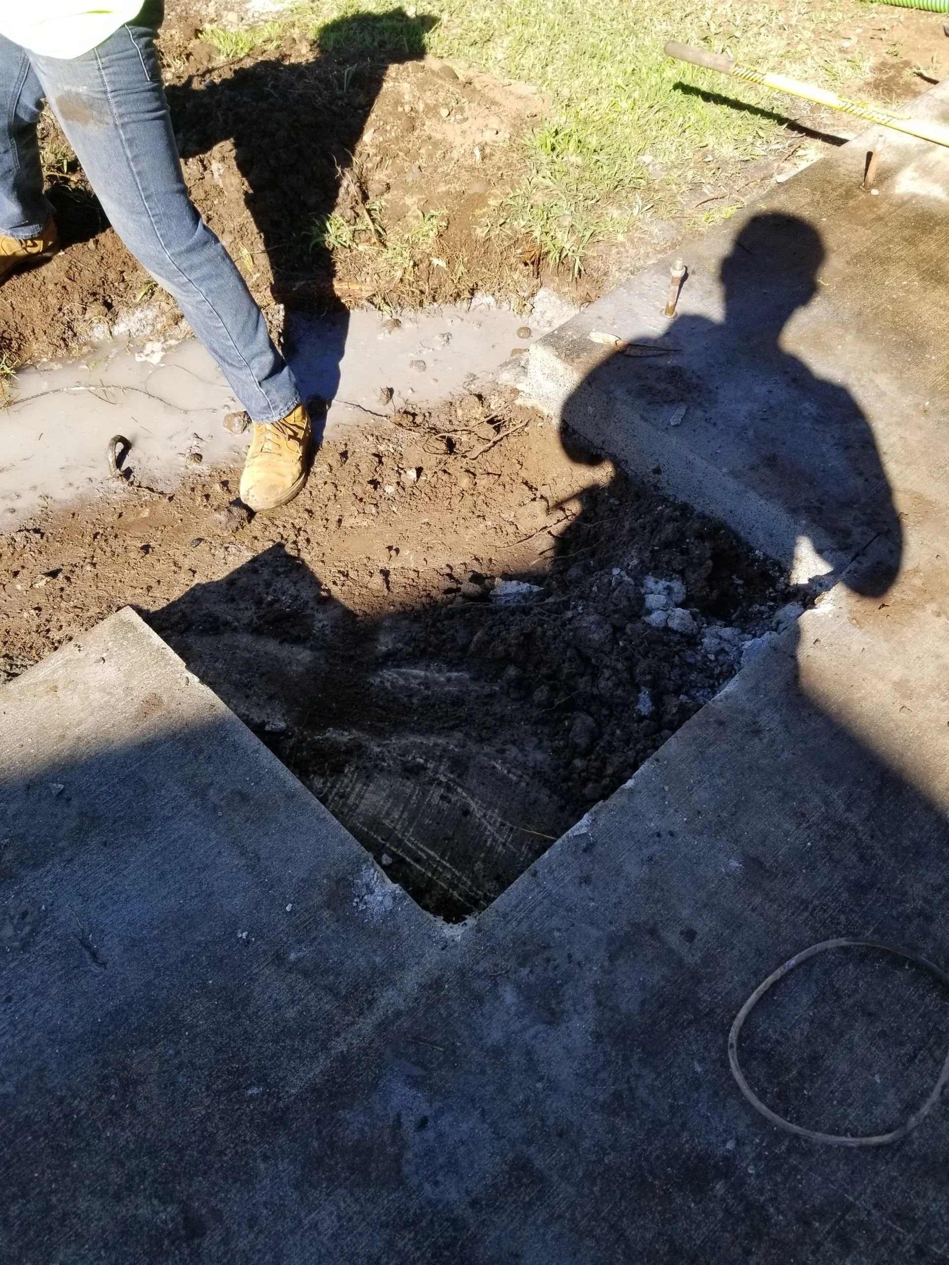 Concrete access opening exposed during excavation.