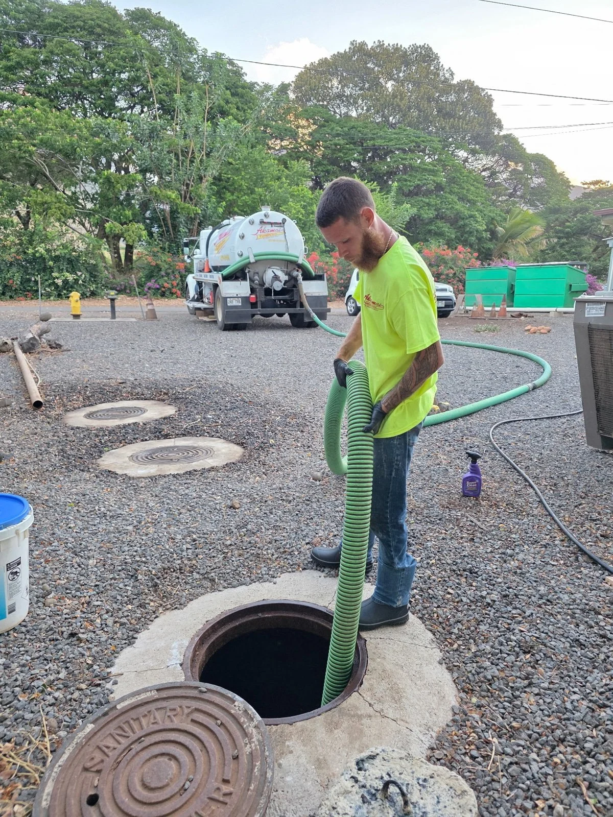 Akamai crew member handling a pumping hose.