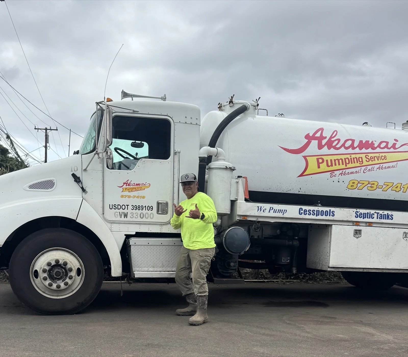 Akamai crew member beside a tanker truck.