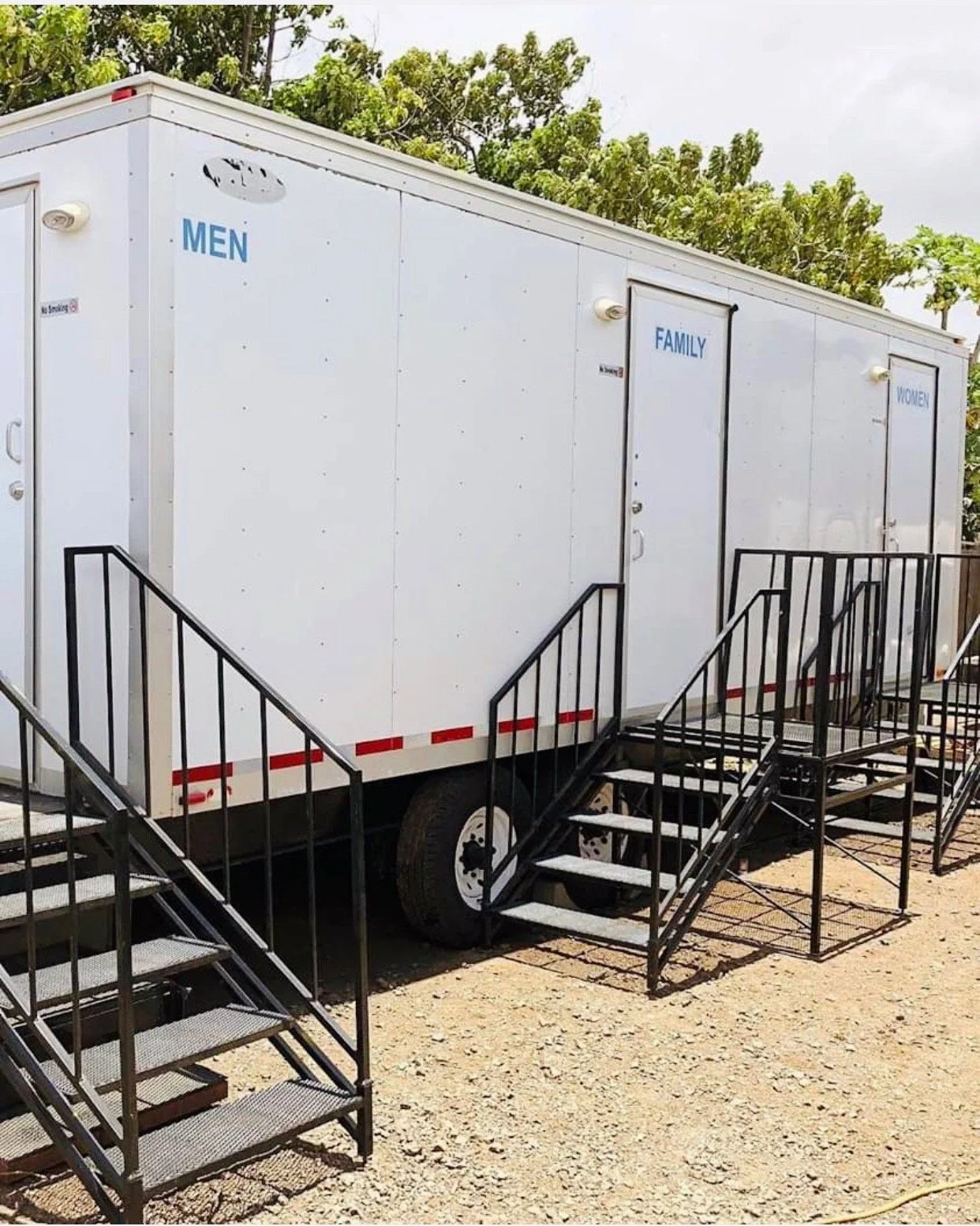 Exterior and access steps of an event restroom trailer.