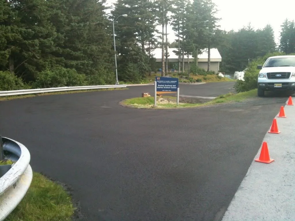 Recently seal coated parking lot of the University of Alaska Anchorage, Kodiak Seafood and Marine Science Center.