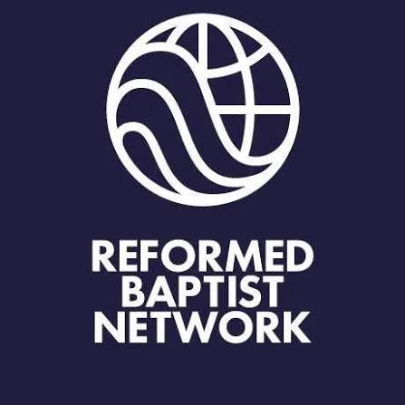 Logo of Reformed Baptist Network featuring a stylized globe with lines and text below reading 'Reformed Baptist Network'.