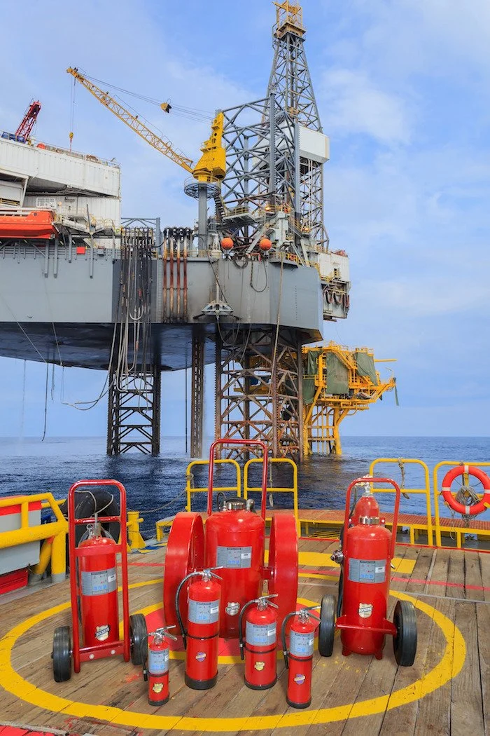 Buckeye wheeled and portable fire extinguishers on the helideck of an offshore drilling rig