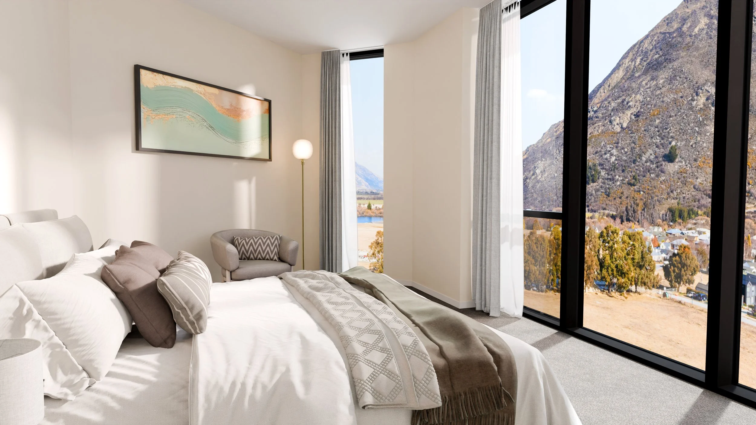 A modern bedroom with a large window showing a mountain landscape, a bed with white and beige bedding, a gray armchair, a floor lamp, and a framed abstract art piece on the wall.