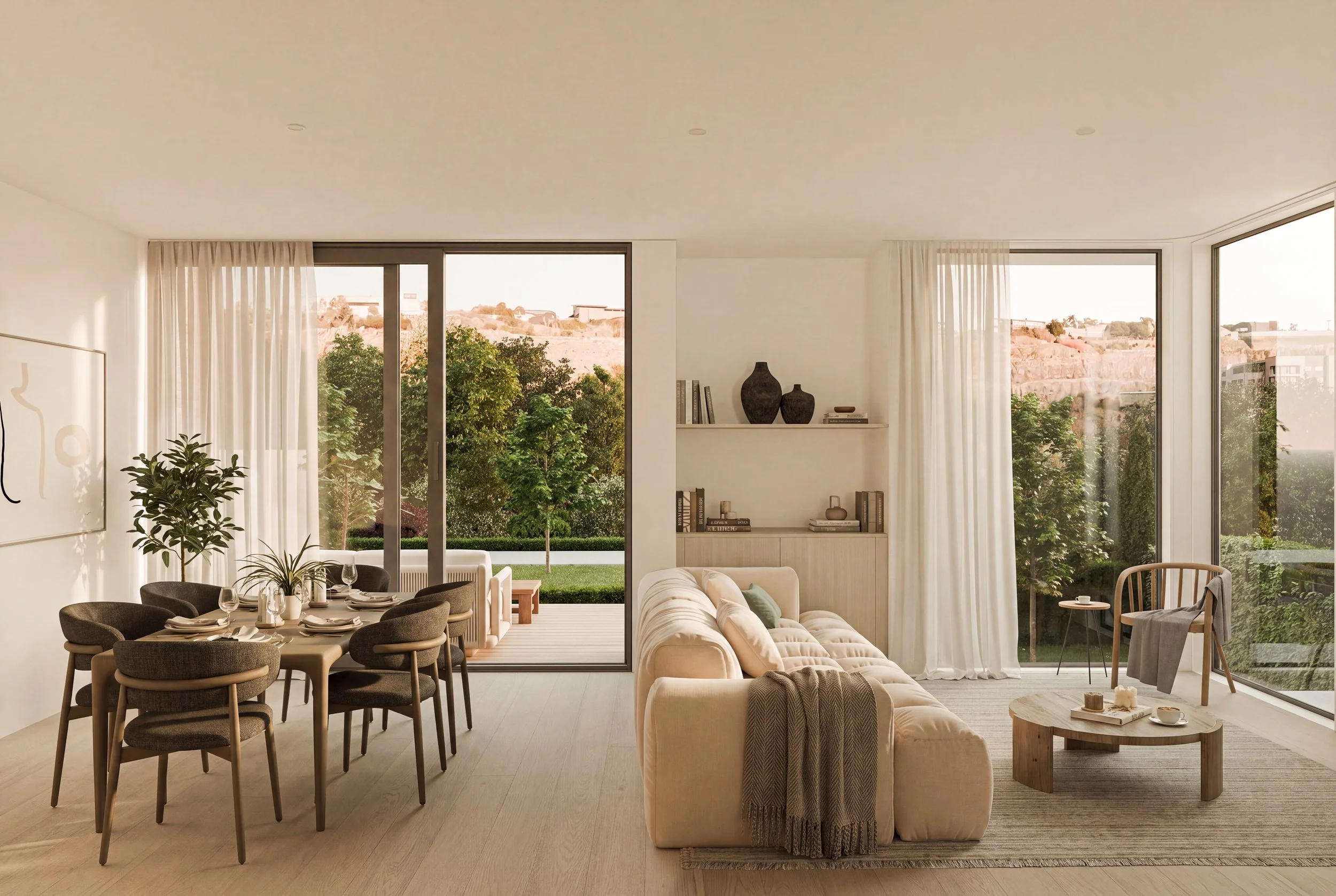 Modern living room with large windows, beige sofas, a dining table with chairs, plants, shelves with decorative items, and an outdoor view of trees and hills.