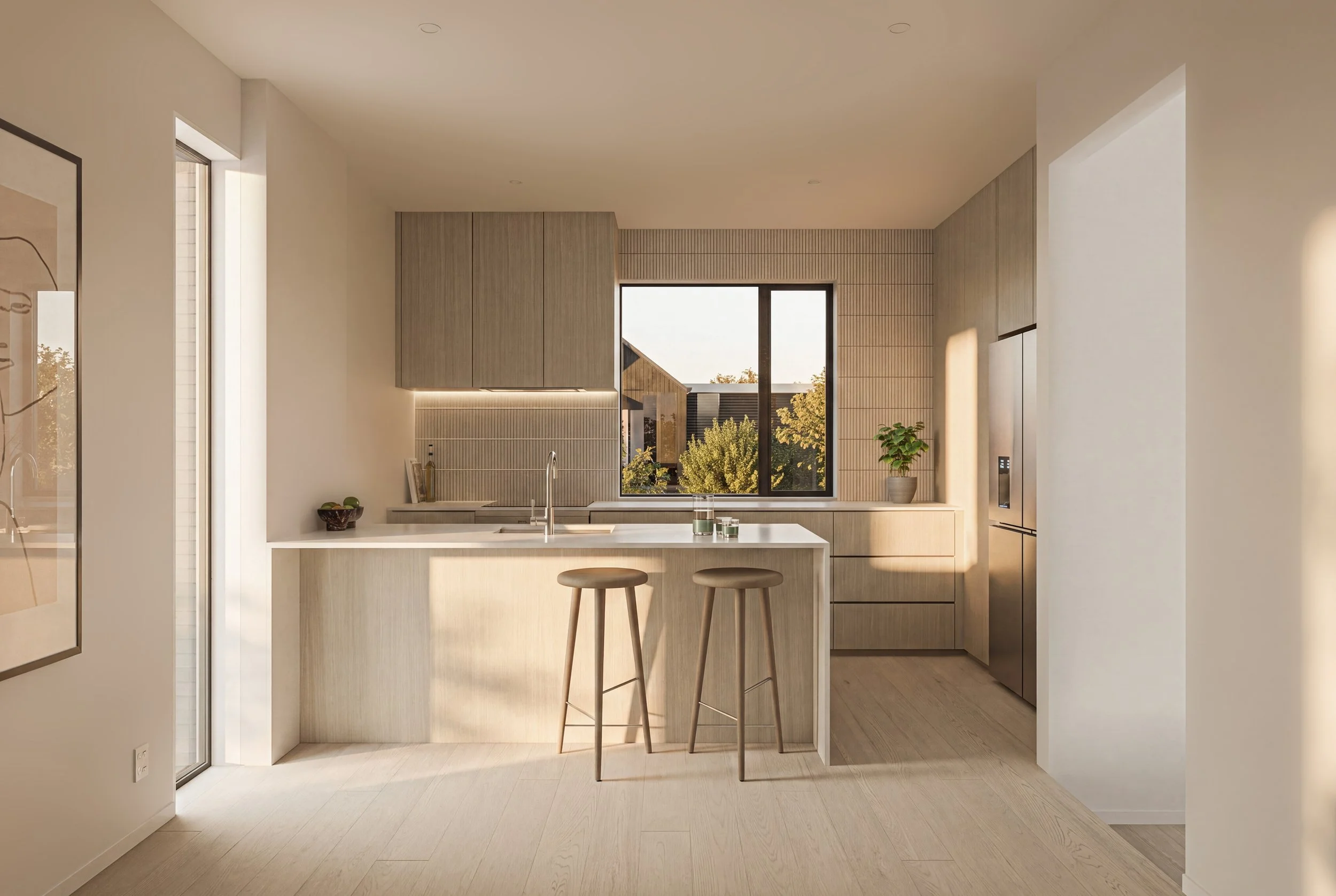 Modern kitchen with light wood cabinetry, a central island with two stools, and a large window showing trees outside.
