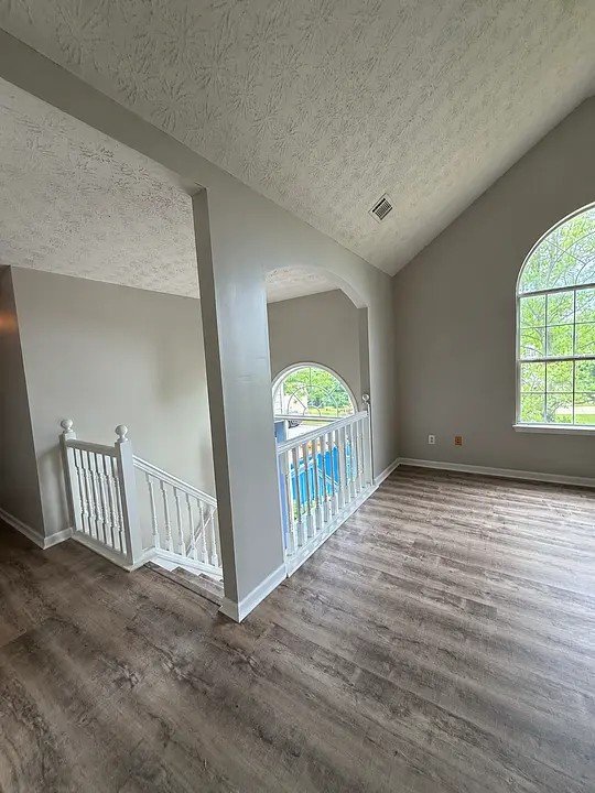 Freshly painted interior walls and trim in a two-story home