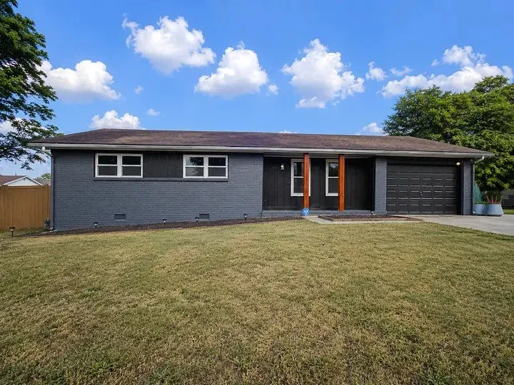 Freshly painted dark gray brick home exterior