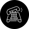 Line drawing of a vintage rotary telephone.