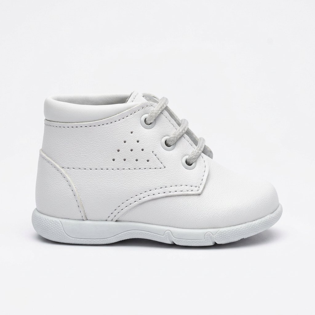 White leather children's ankle boots with laces and textured rubber soles