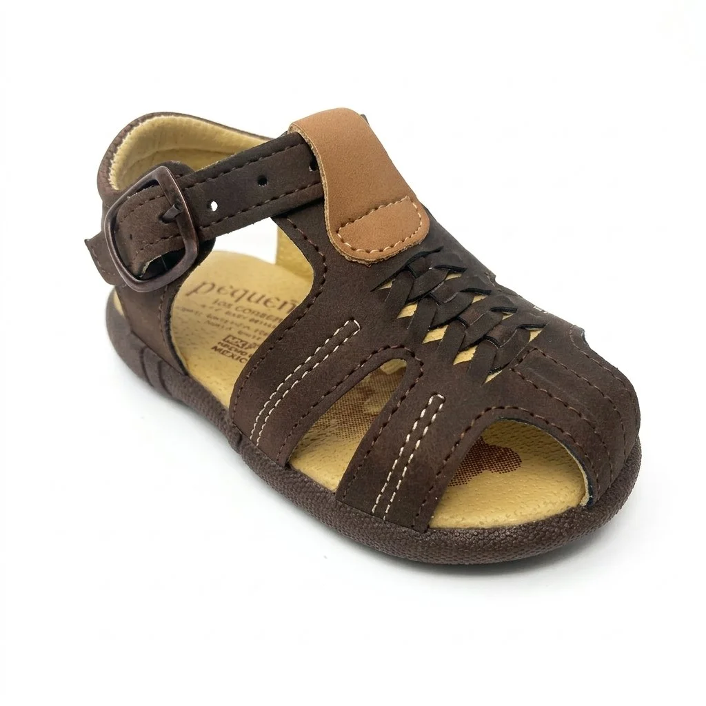 Brown leather closed-toe sandal with adjustable buckle strap and woven cutout detailing