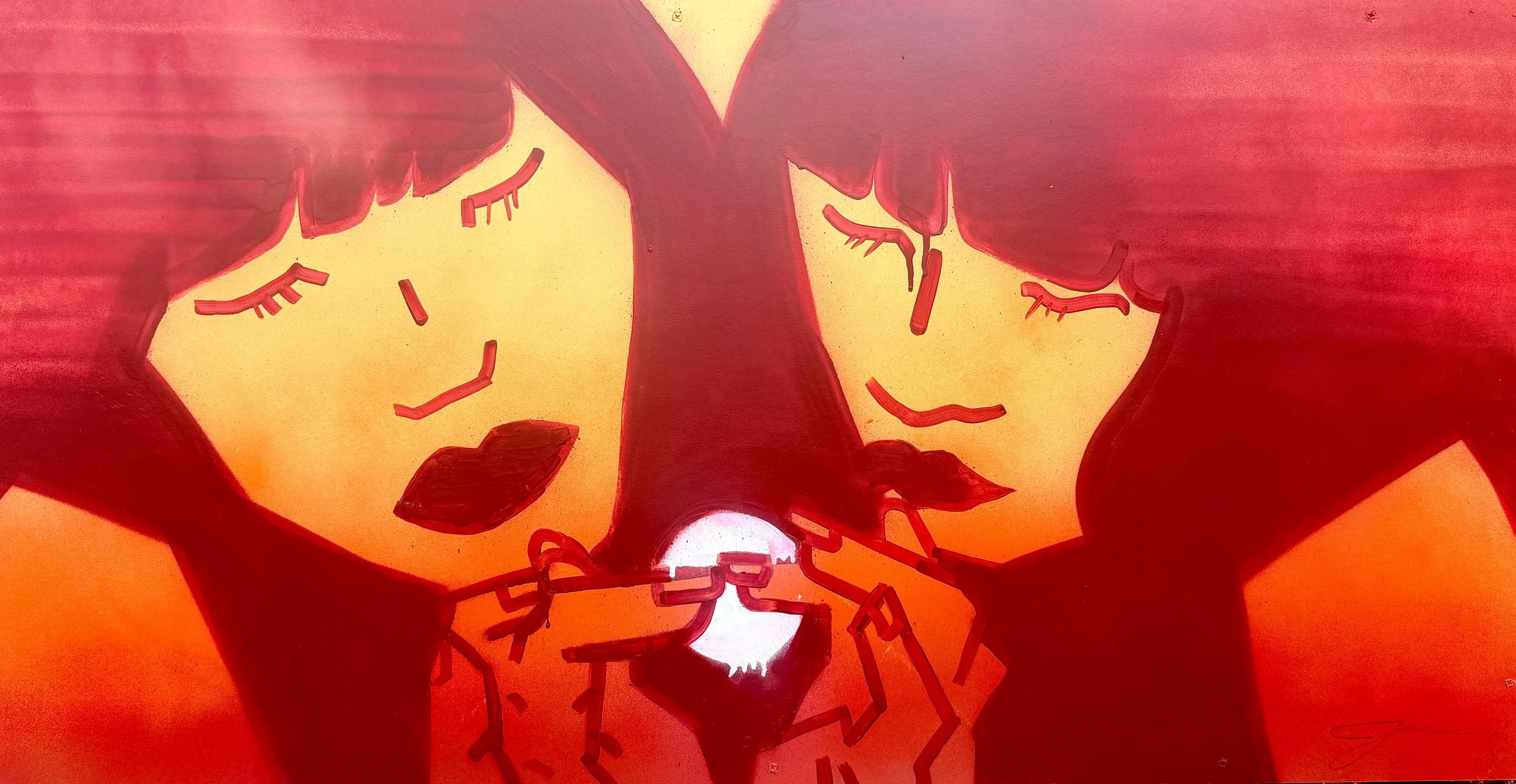 A painted mural of two women with closed eyes, holding a small glowing heart between them, with warm colors and stylized features.