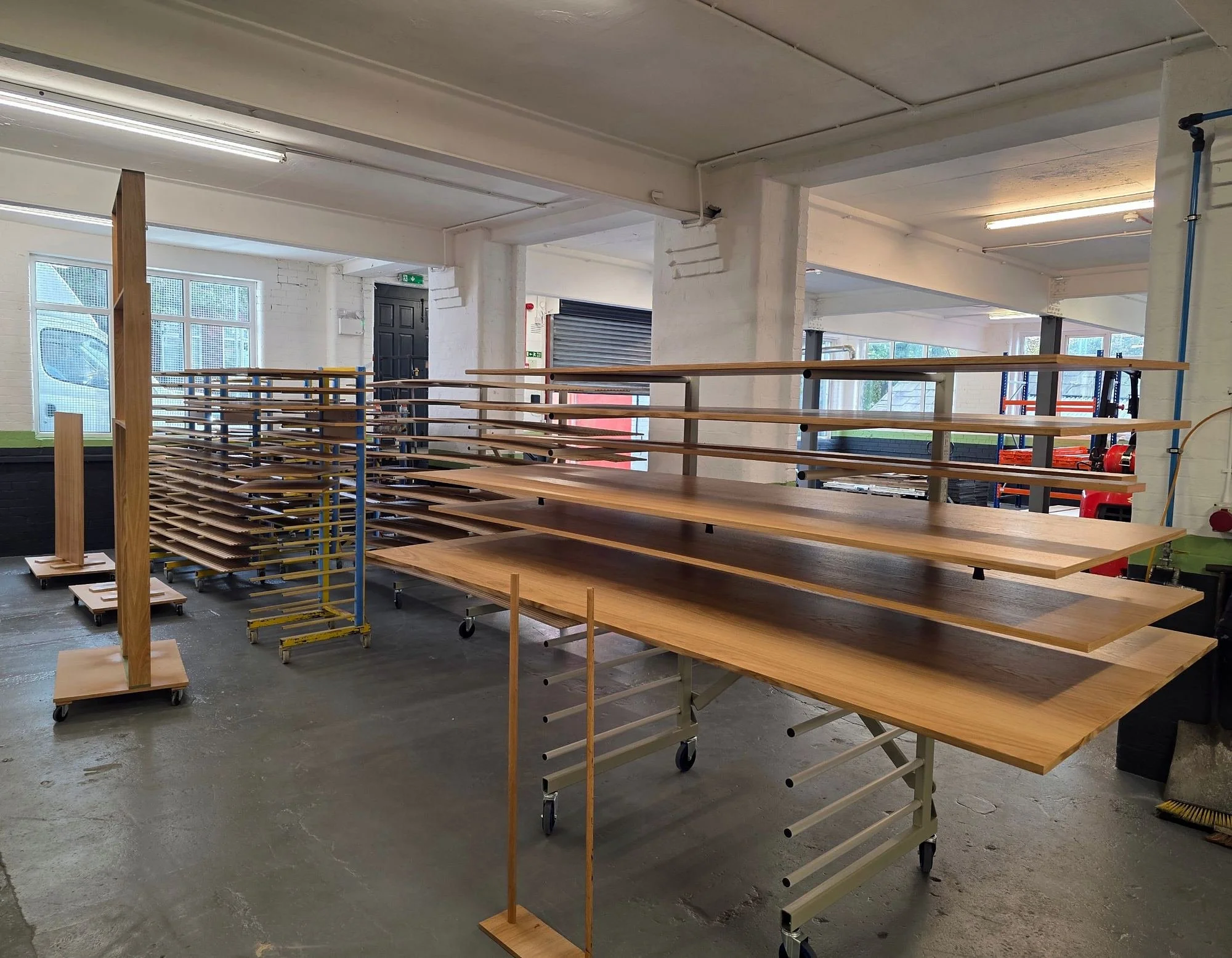 Workshop with timber panels on drying racks