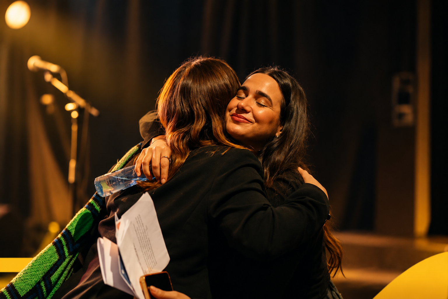 A storyteller and audience member share a moment after one of our experiences.