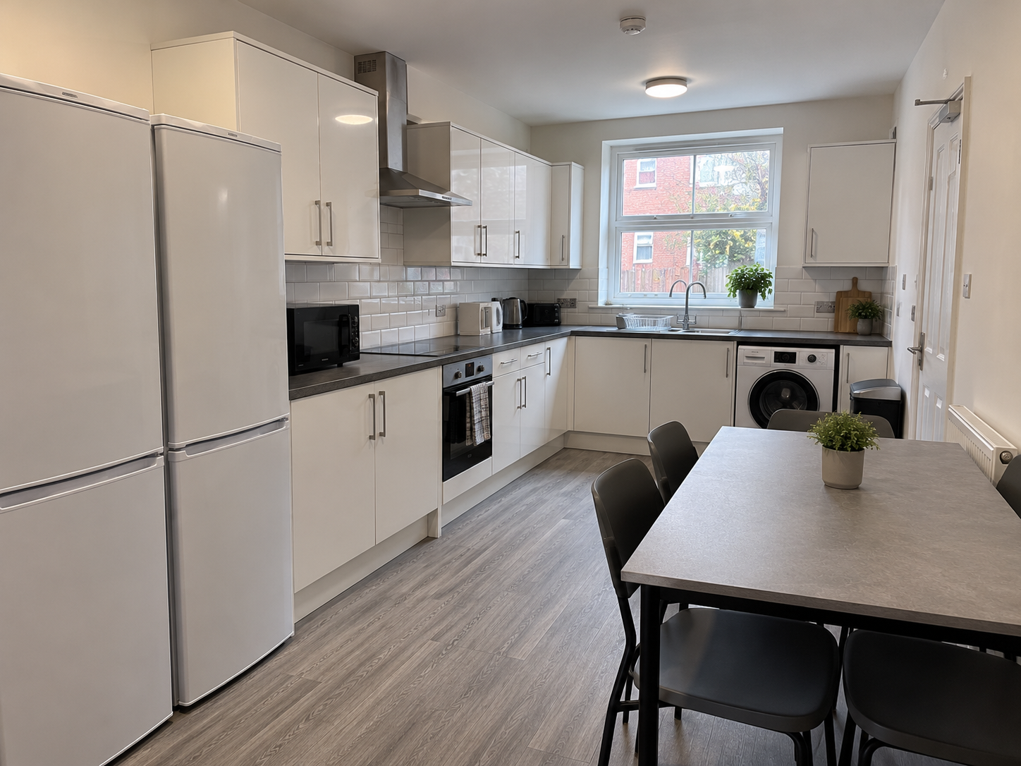 Modern Galley Kitchen and Dining Area.png